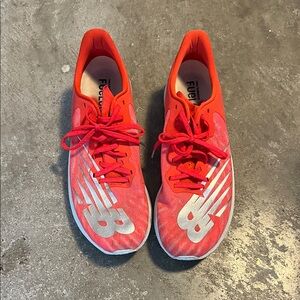 New Balance FuelCell TC running shoes in the EnergyStreak Neo Flame colorway